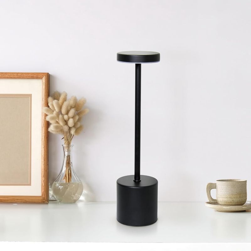 Desk lamp placed on a table in a living room setting.