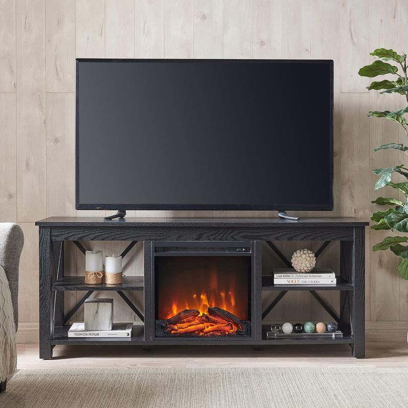 Henn&amp;Hart black TV stand with log fireplace on, flames visible inside.