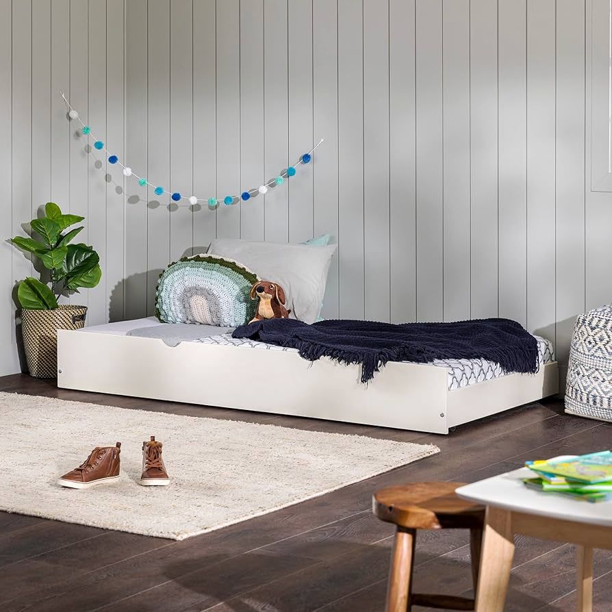 Walker Edison Solid Wood Twin Trundle Bed in white, shown in a bright room with pillows and bedding.