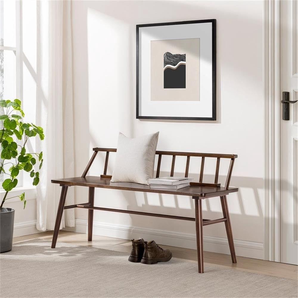 Walker Edison Lennon 48&quot; Spindle-Back Bench in walnut placed in a styled room with a decorative pillow on the seat.