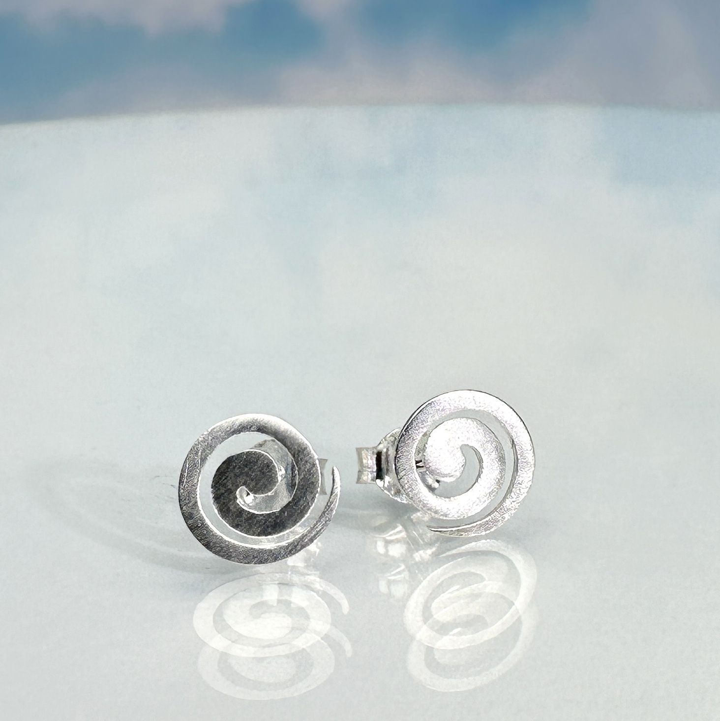 stud earrings in 925 sterling silver, matt brushed with a spiral motif