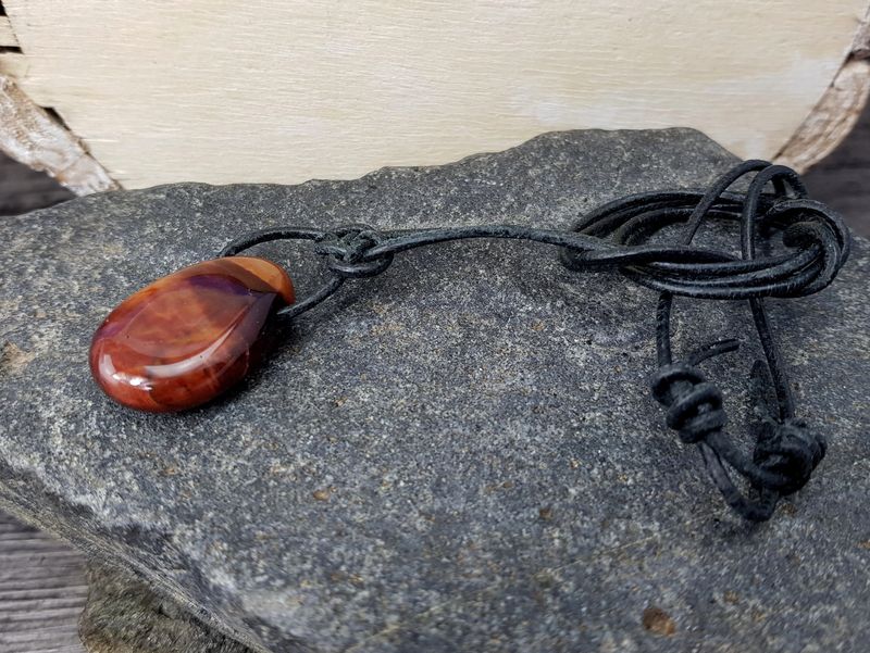 Red tiger's eye tumbled stone