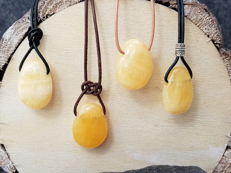 Orange calcite tumbled stone