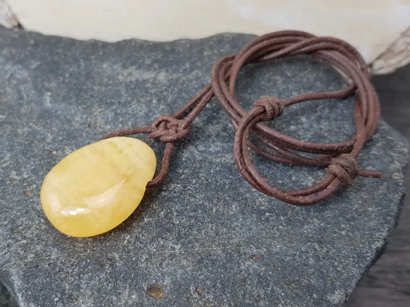 Orange calcite tumbled stone
