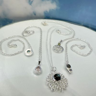 Set gemstone pendants with chains