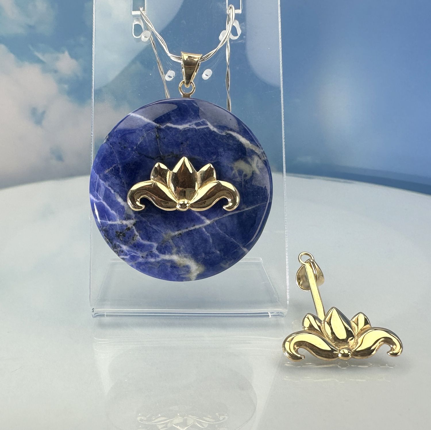 Donut holder in the shape of a lotus flower made from gold-plated copper.