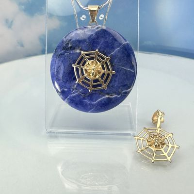Donut holder in the shape of a spider&#39;s web made from gold-plated copp