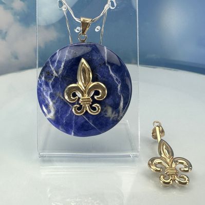 Donut holder in the shape of a French lily made from gold-plated copper.