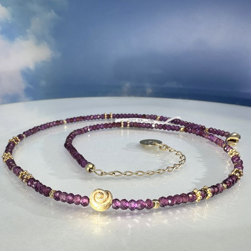 Elegant necklace made of genuine, faceted rhodolithe combined with gold plated 925 sterling silver.