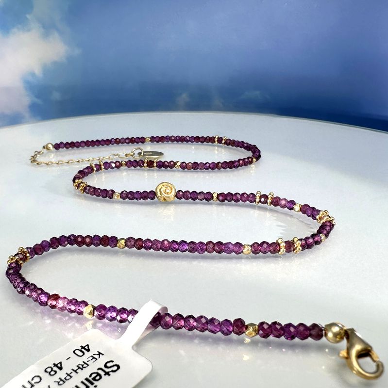 Elegant necklace made of genuine, faceted rhodolithe combined with gold plated 925 sterling silver.