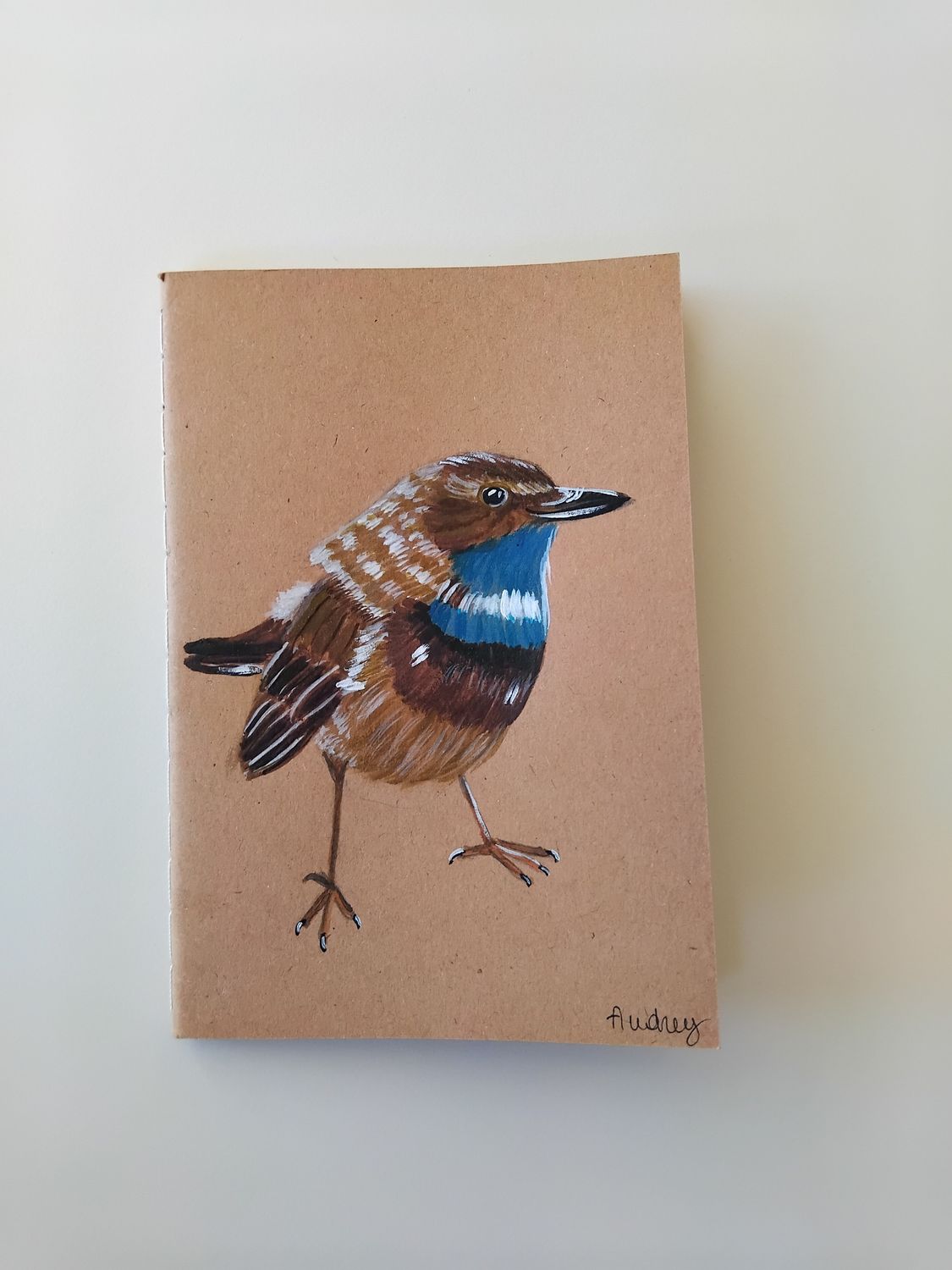 Schrift met blauwborstje