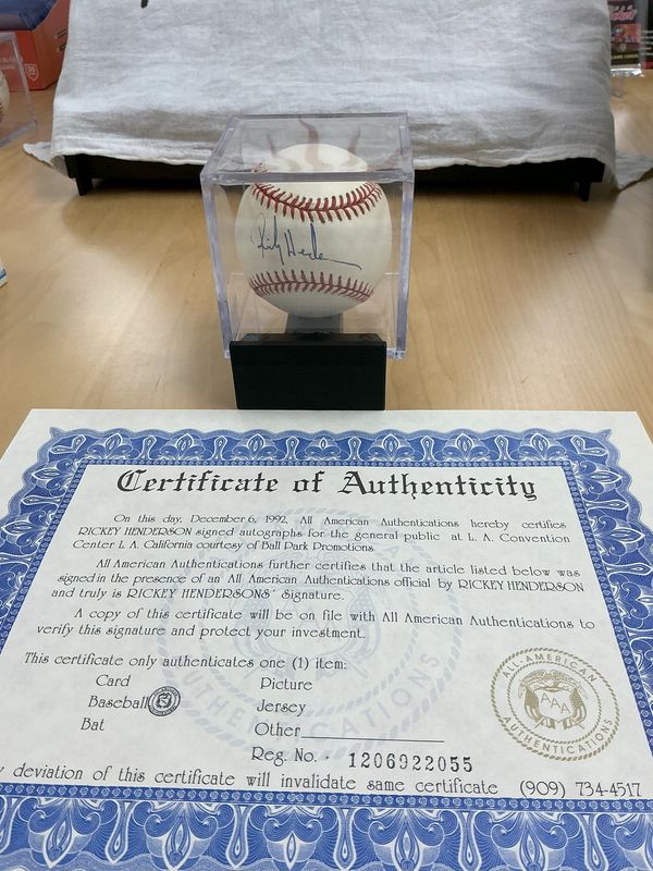 Rickey Henderson Autographed Baseball with All-American Authentication COA