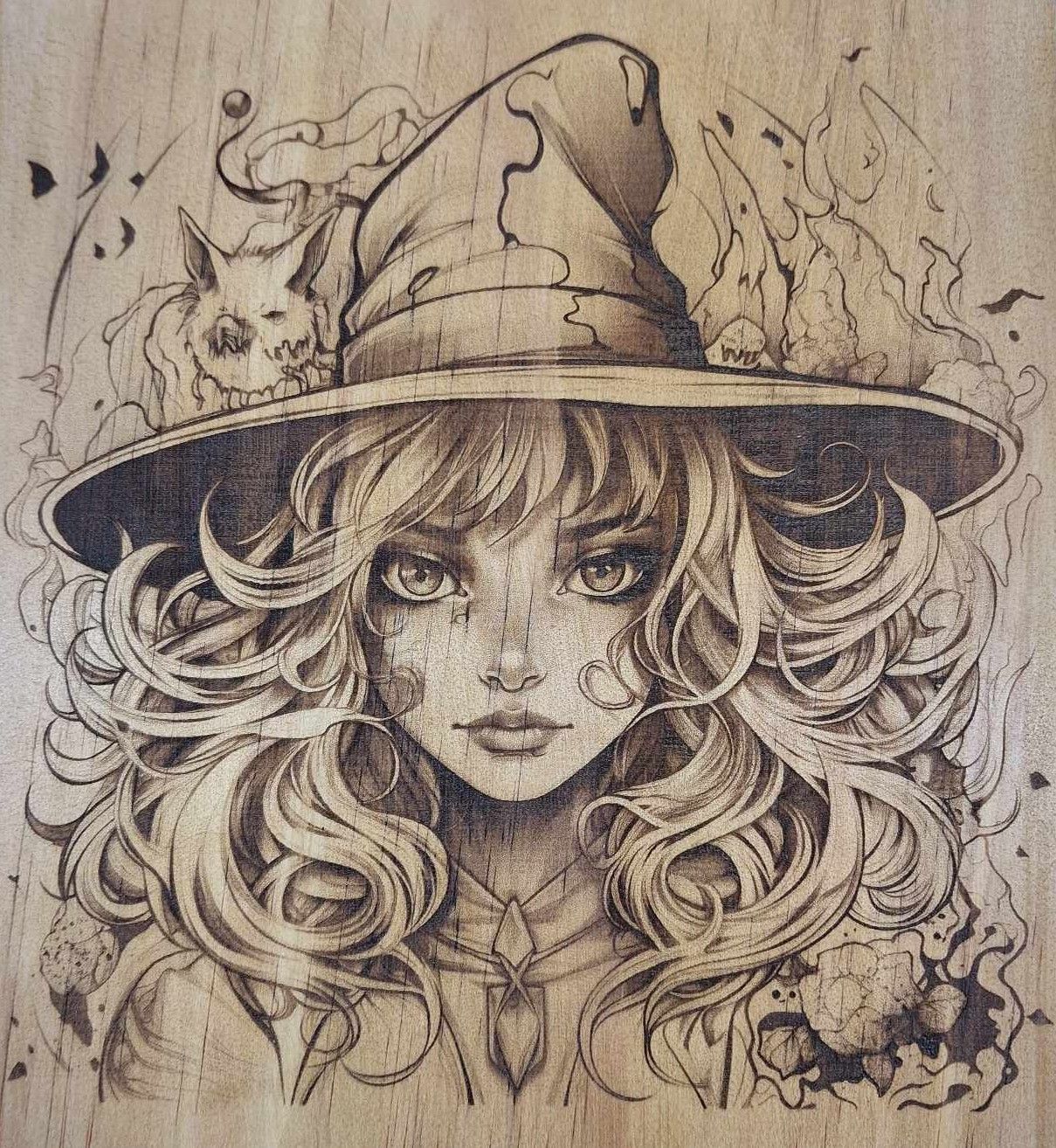 Pyrogravure laser d'une sorcière sur bois