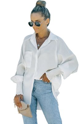 Chemise blanche à manches bouffantes et poches
