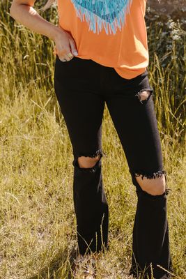 Jean noir taille haute déchiré à pattes d&#39;éléphant