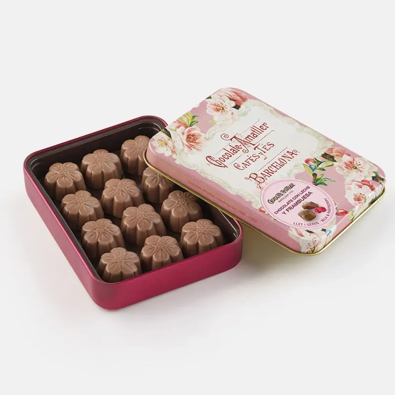 Caja metálica con bombones de chocolate con leche y frambuesa