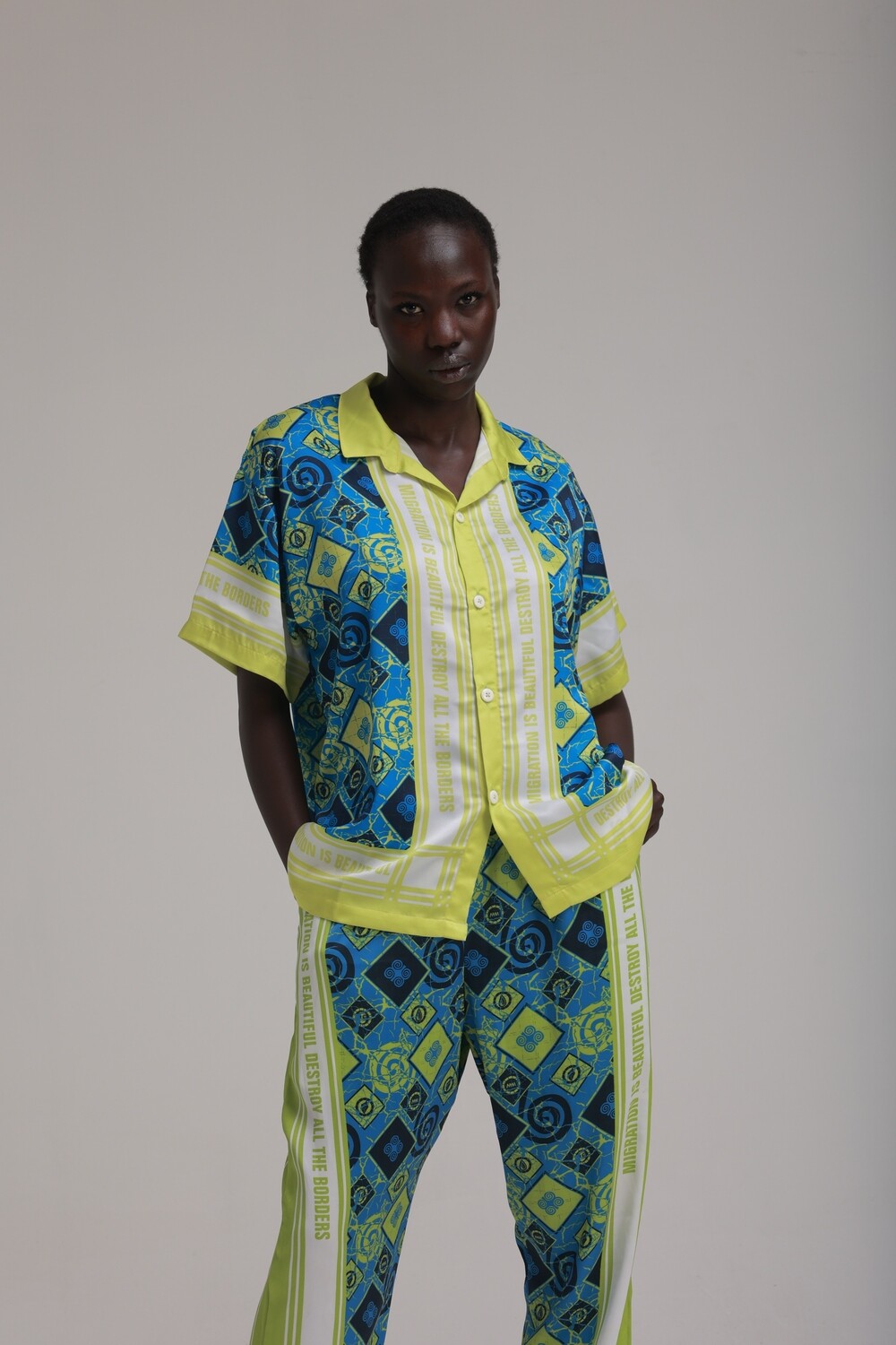 MIGRATION IS BEAUTIFUL SHIRT: GREEN AND BLUE