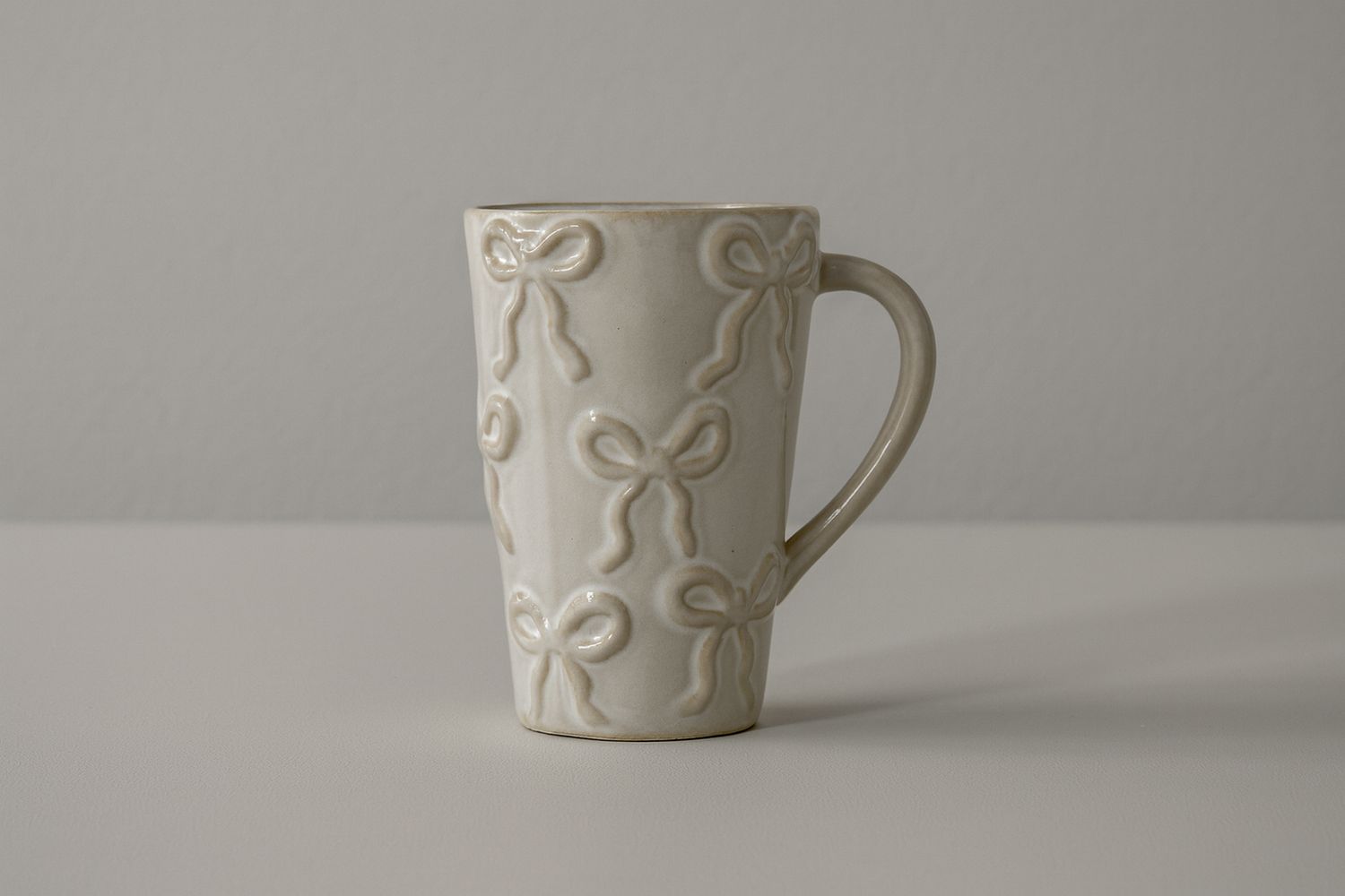 Bow Textured Stoneware Tall Mug – White