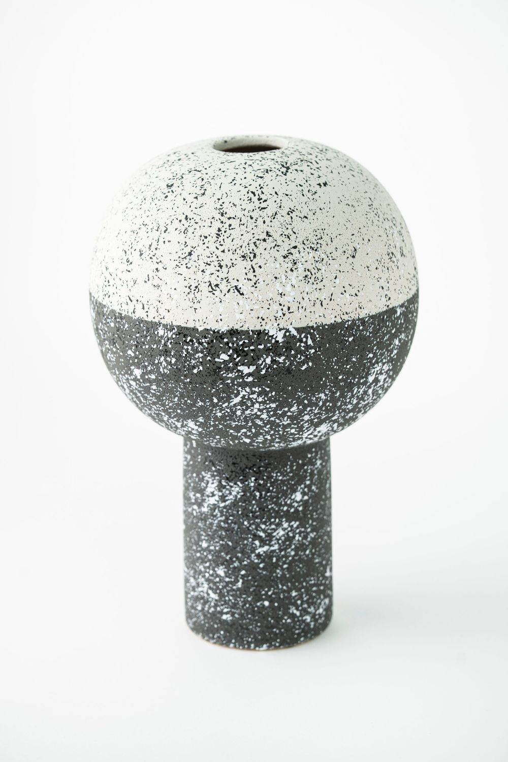 Black and white vase pedestal