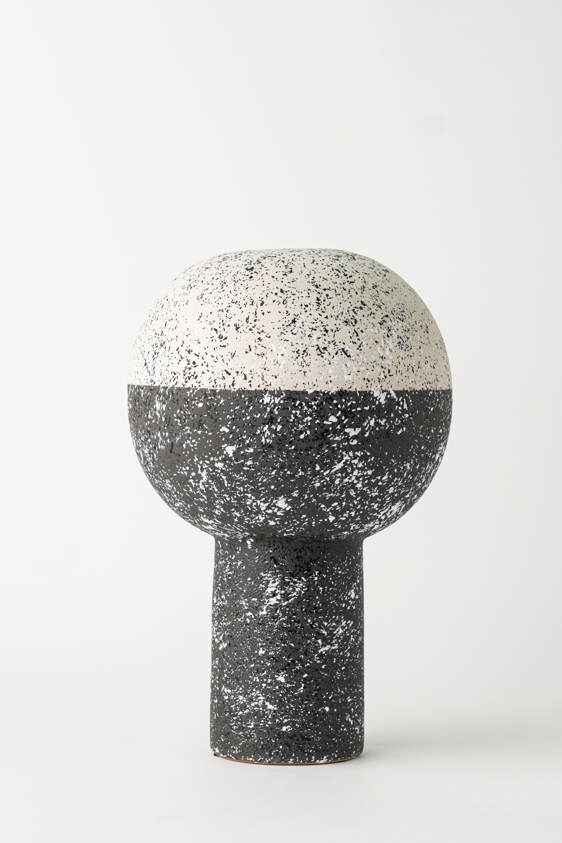 Black and white vase pedestal