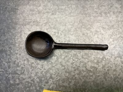 Dark ceramic spoon