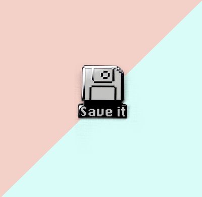 A beautiful enamel pins that looks like the classic save pixel icon, with the word &quot;Save It&quot; at the bottom of the pin. 