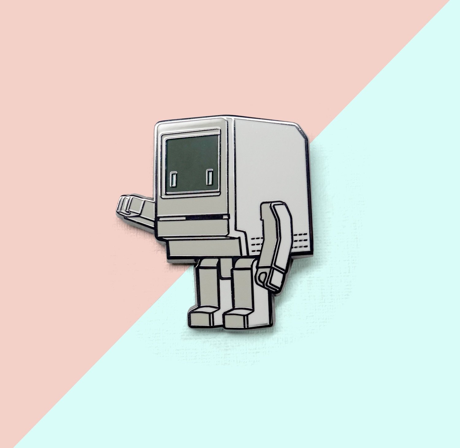 beautiful ename pin with a graphic of Classicbot, a robot character that looks like a retro classic computer
