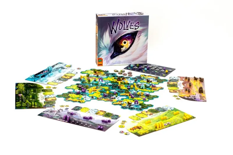 The Wolves board game components and box, featuring colorful game board, cards, tokens, and box with wolf eye illustration, for 2-5 players.