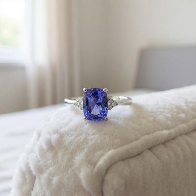 9ct White Gold Tanzanite &amp; Diamond Ring – 8x6mm Cushion Cut with 0.06ct Side Diamonds