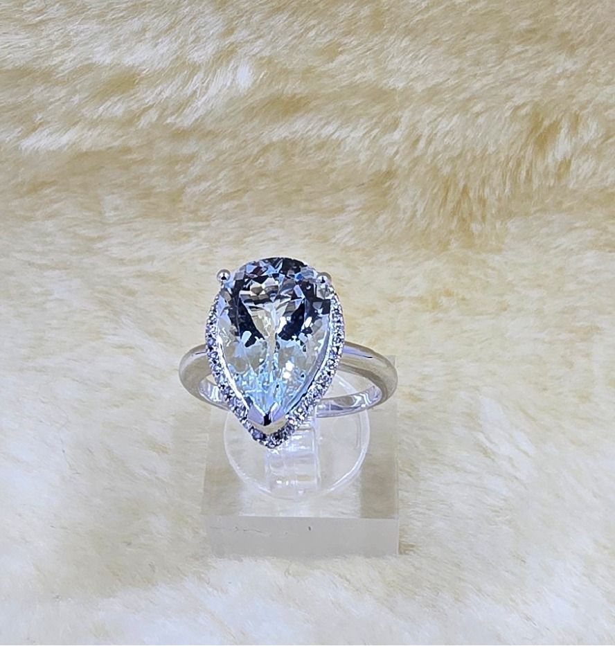 9ct White Gold Pear Aquamarine Halo Ring – 15x10mm Center Stone with 0.14ct Diamond Border