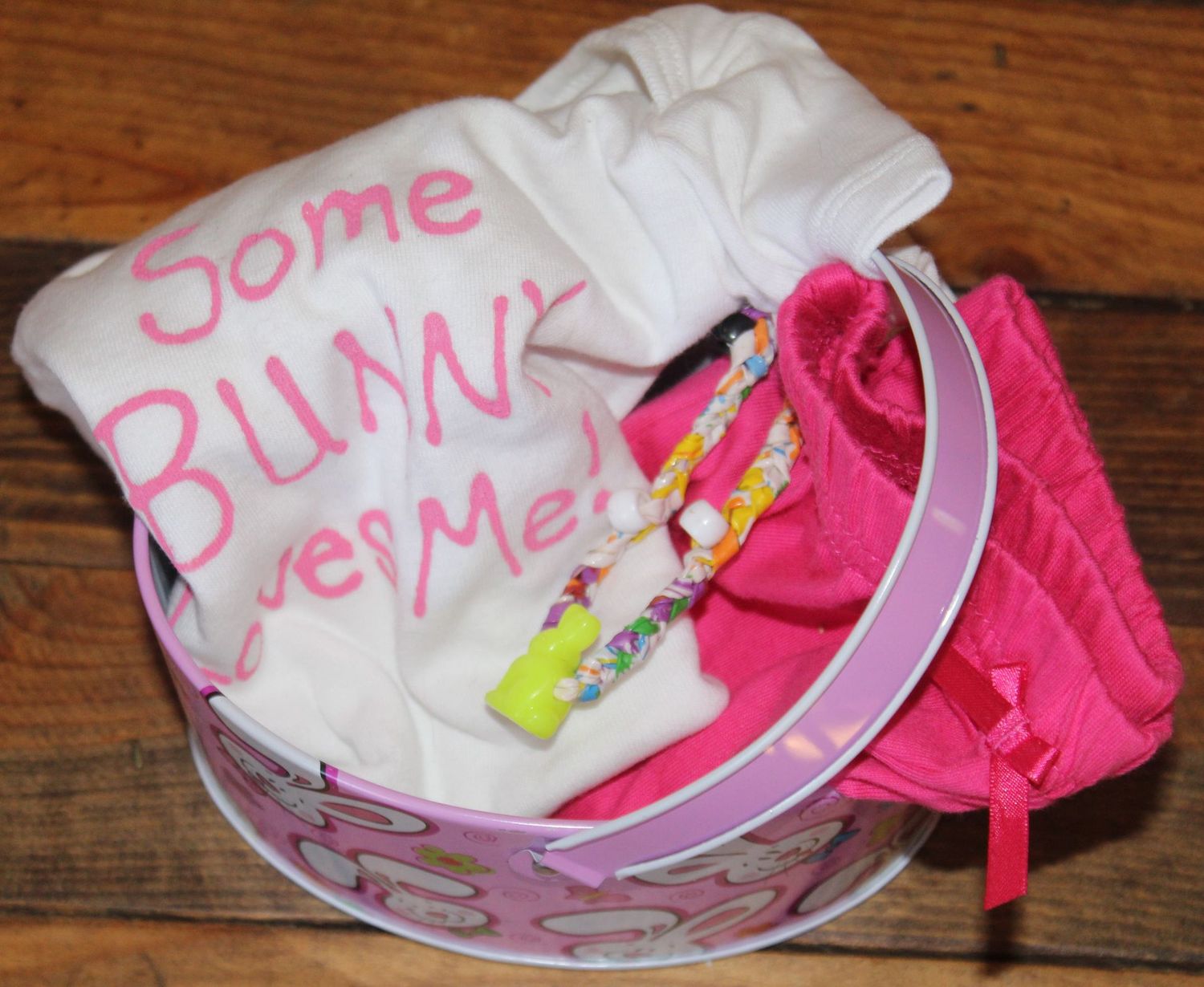 Easter gift set with hand painted bunny onesie, pink pants, and decorative basket for baby girl