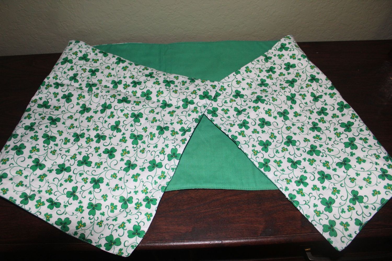 Close-up of handmade shamrock fabric on reversible St. Patrick’s Day table runner.