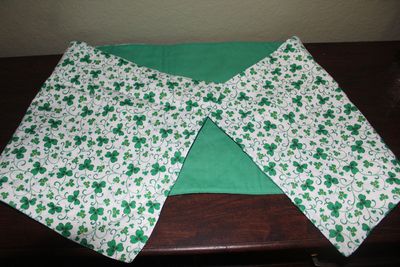 Close-up of handmade shamrock fabric on reversible St. Patrick’s Day table runner.