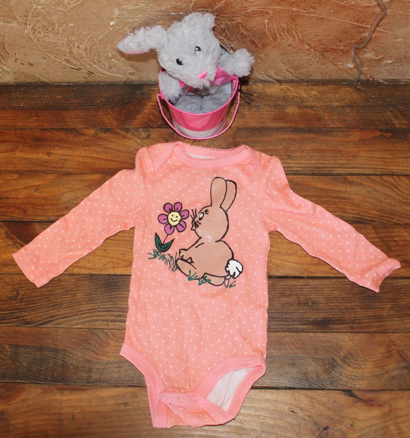 Hand-painted bunny baby onesie with pink polka dots and floral design for Easter spring outfit