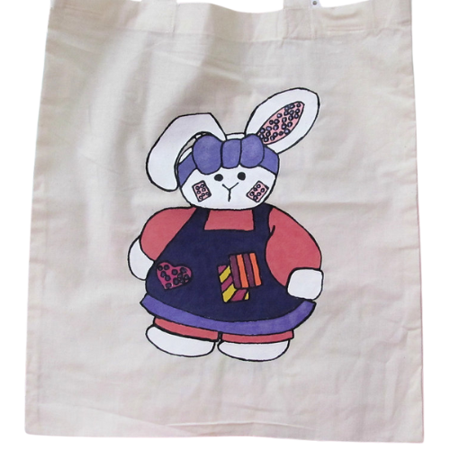 Handmade Easter bunny tote bag with painted rabbit and decorative Easter eggs on reusable cotton bag.