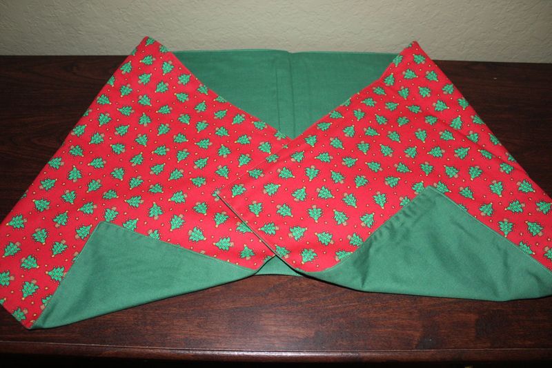 Handmade reversible Christmas table runner with red fabric and green tree print design