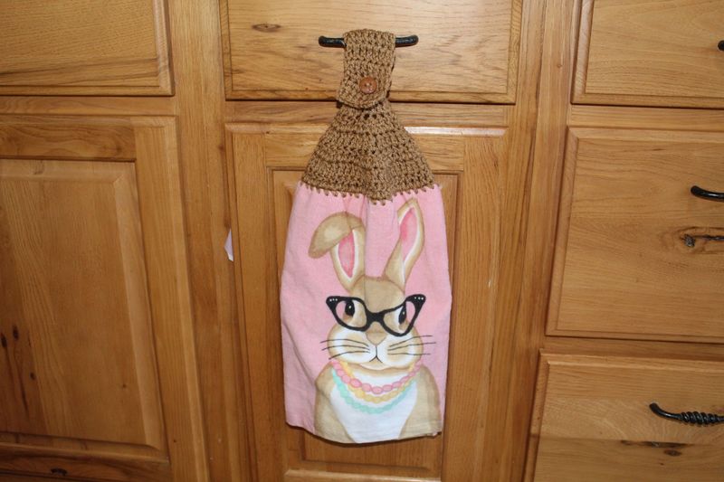 Decorative Easter bunny hanging dish towel with brown crochet top and cute bunny with glasses design.