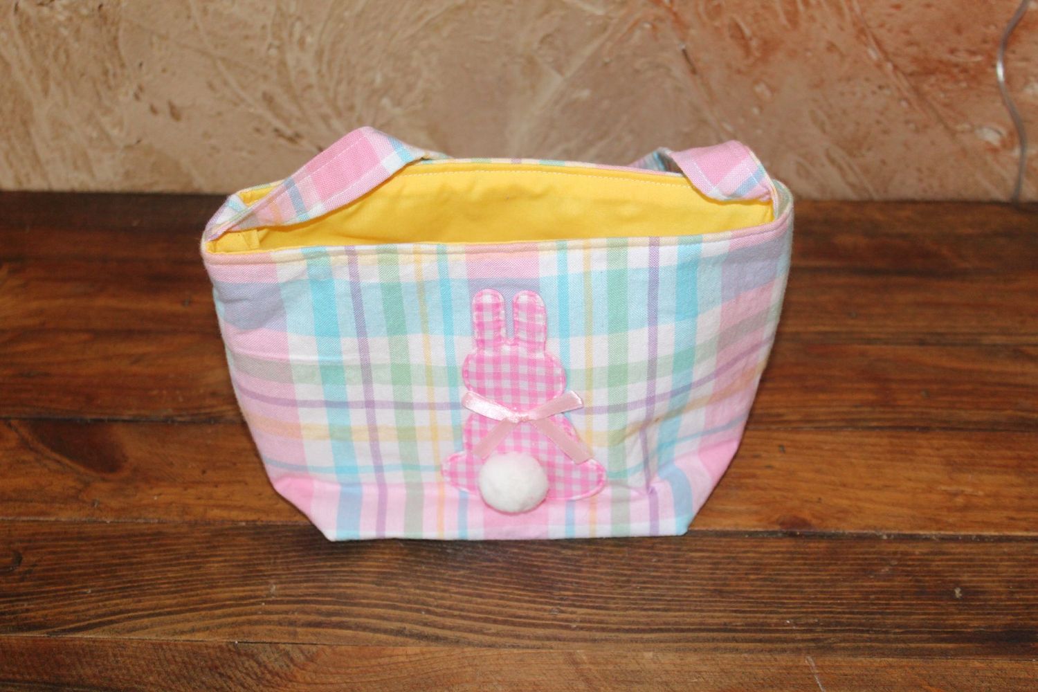 Handmade pastel plaid Easter basket tote with pink bunny applique and pom pom tail for kids Easter egg hunts.