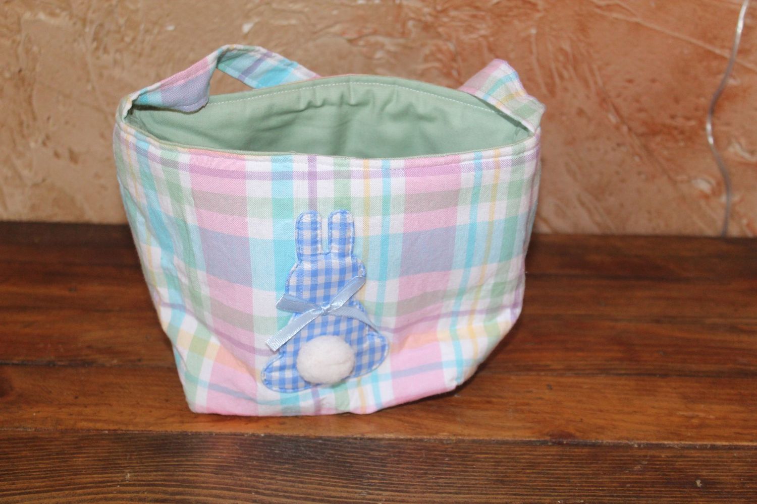 Handmade pastel plaid Easter basket tote with bunny applique and pom pom tail, reusable kids Easter egg hunt basket.