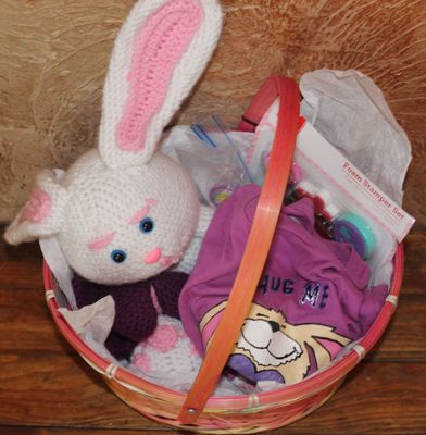 Handmade Easter bunny gift basket with crochet plush bunny, girls bunny shirt, and heart stamp craft kit.