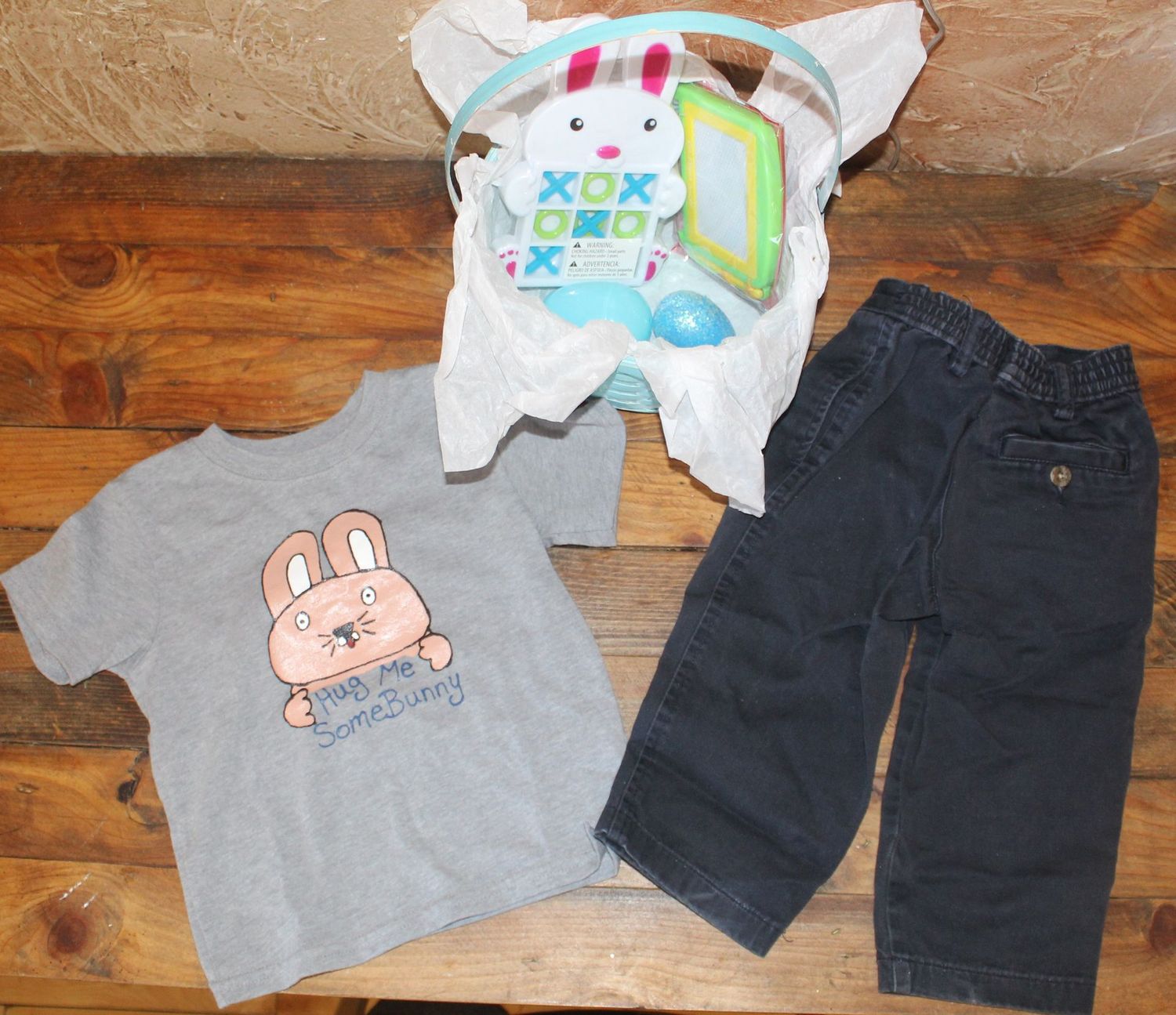 Easter toddler outfit with bunny shirt, black pants, and Easter basket gift set