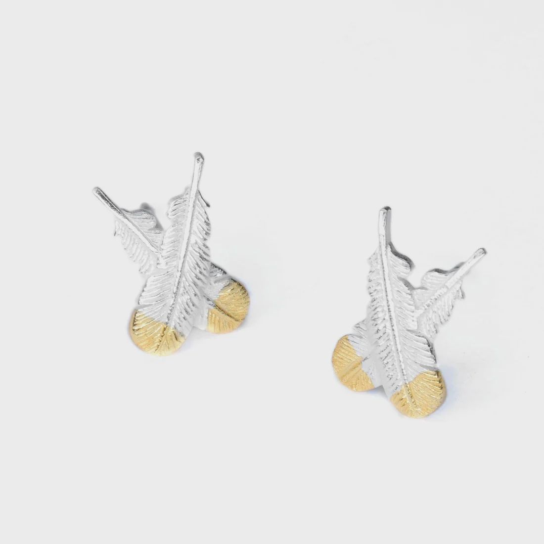 Huia Crossed Feather Earrings - Silver with gold tips