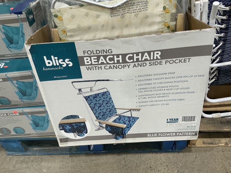 Folding beach chair with canopy inside pocket