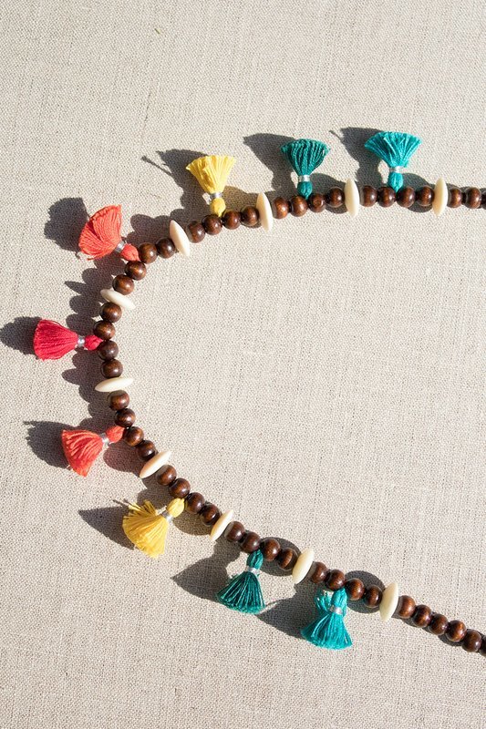Necklace with multi-colored tassels and wood beads