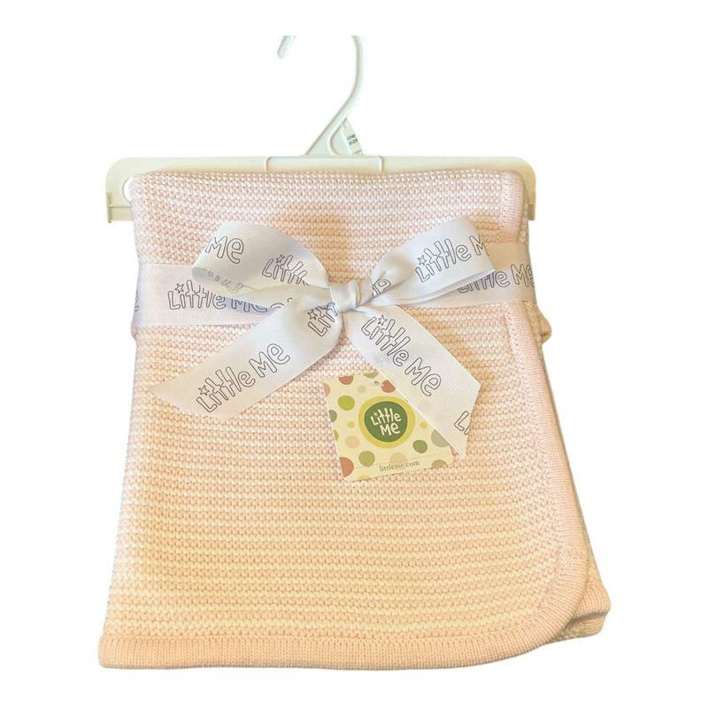 white/pink textured blanket