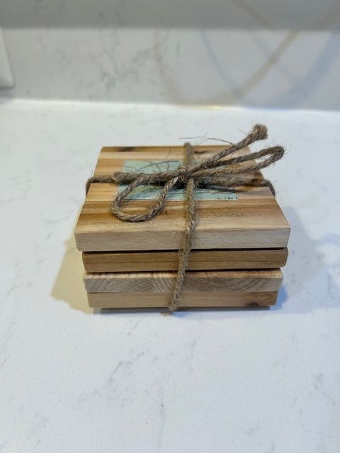 Set of 4 coasters w/ participants art work.