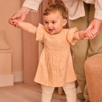 Dirkje meisjes set jurk off white bloem perzikoranje stip