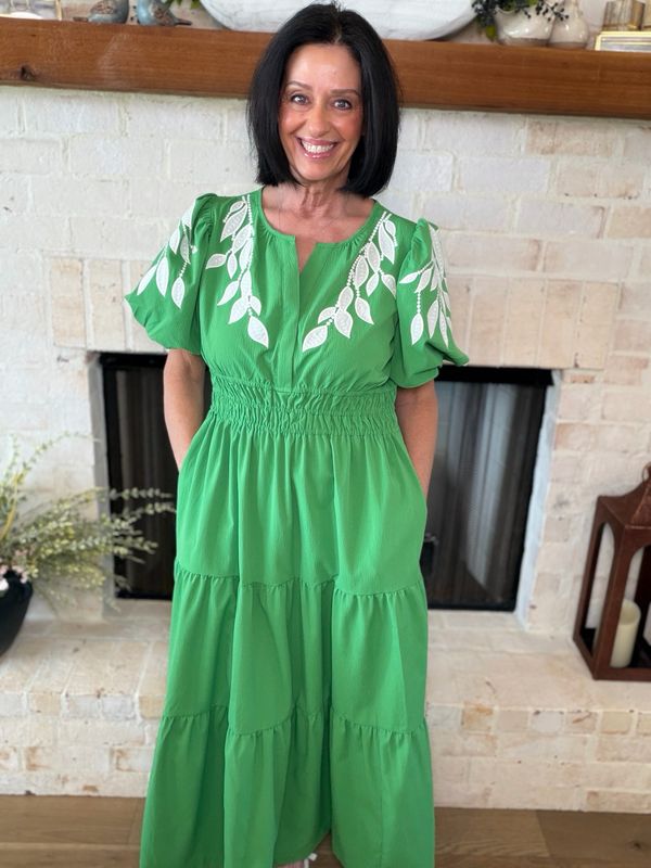 Green Maxi Dress With Floral Accents On Sleeves