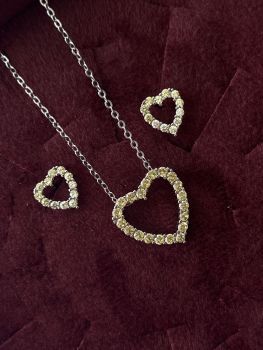 Set semi jewelry with citrine stone in heart format and plating white gold.