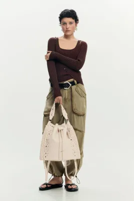 Faux leather convertible bag with studs